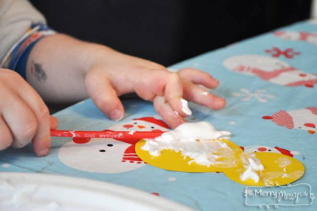 Toddler Craft with Snow Paint for a Winter Garland