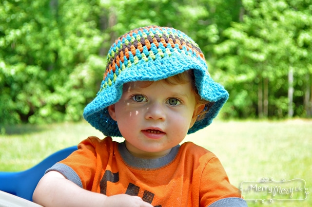 12 to 18 months size hand crocheted summer romper with matching sun hat.