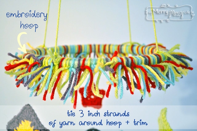 Tie a bunch of strands of yarn onto an embroidery hoop for a super cute baby mobile