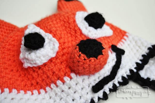 Free Crochet Fox Beanie Pattern - he's a friendly fox with a crooked smile! Pattern comes in all sizes.