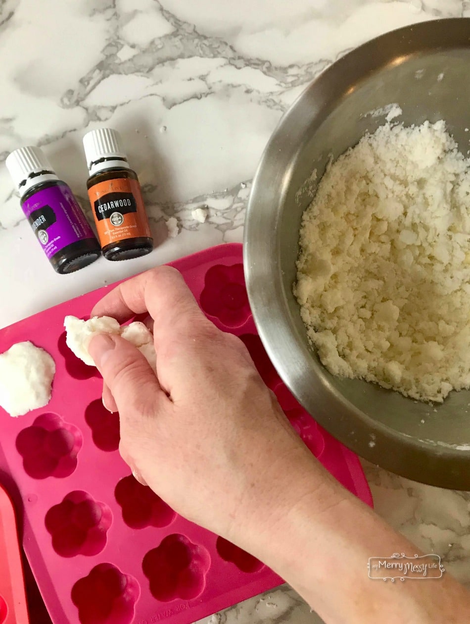 Natural Bath Bombs Recipe Tutorial - pressing the bath bomb recipe into the molds