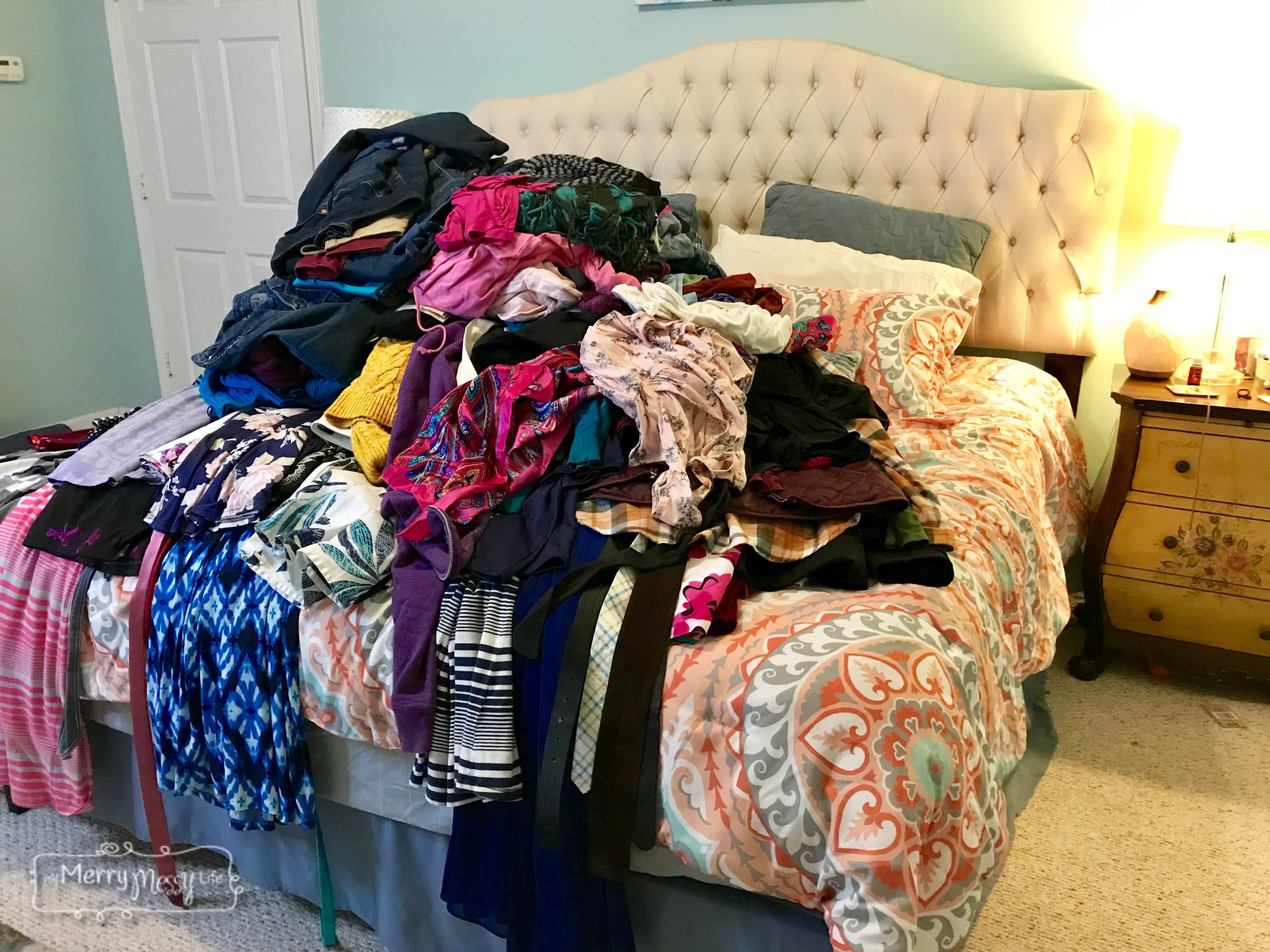 The KonMari Method from Marie Kondo - Gather all of your clothes from all over the house and make a pile