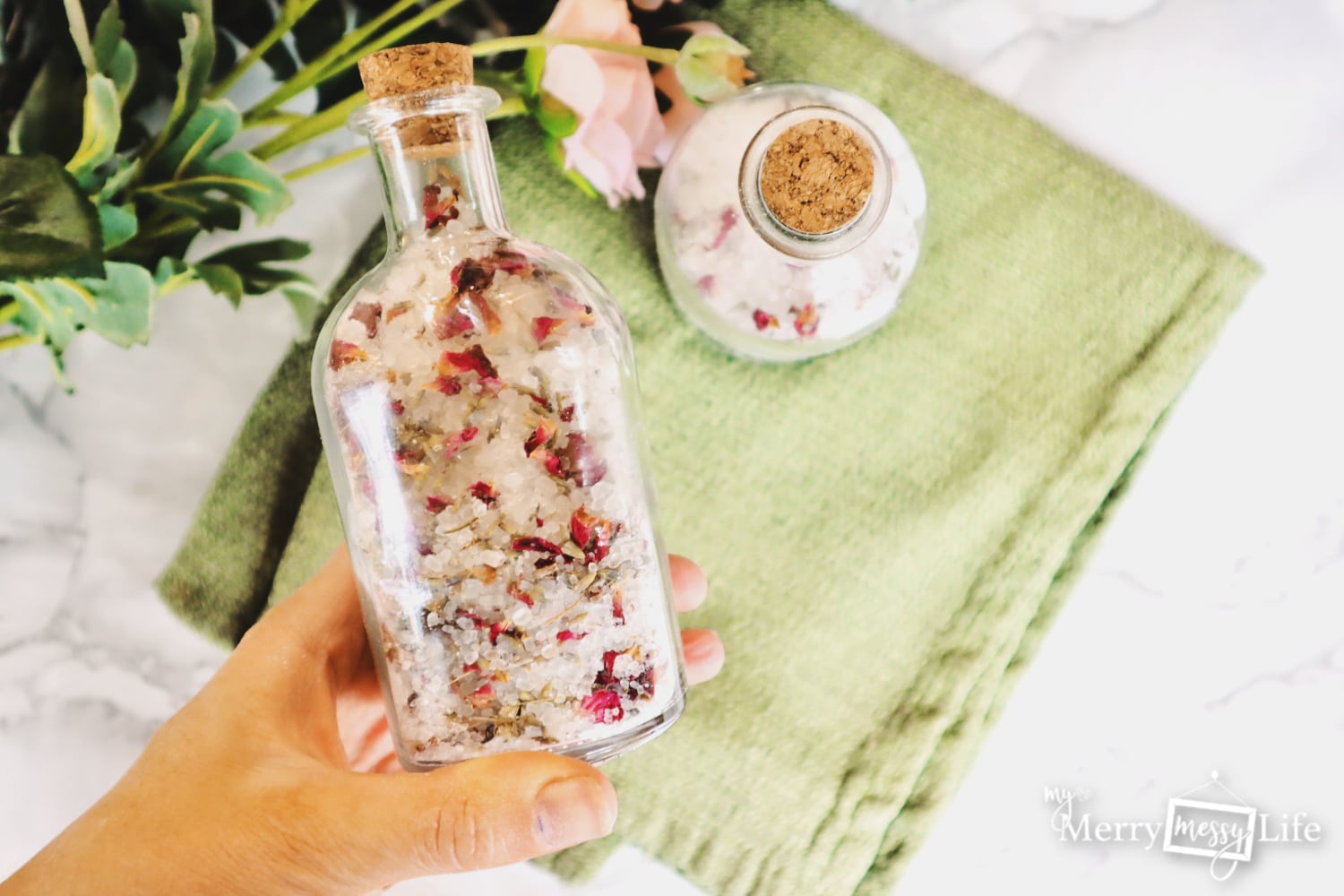 Homemade bath salts recipe with rose and lavender petals