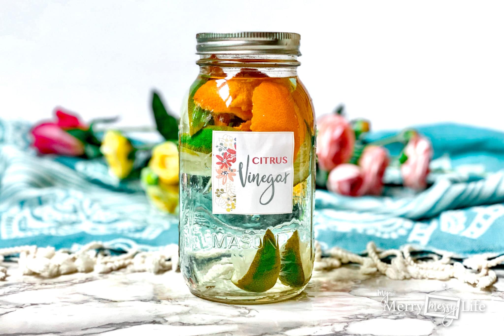 DIY Natural Citrus Infused Vinegar - use the leftover citrus peels as a garbage disposal cleaner!