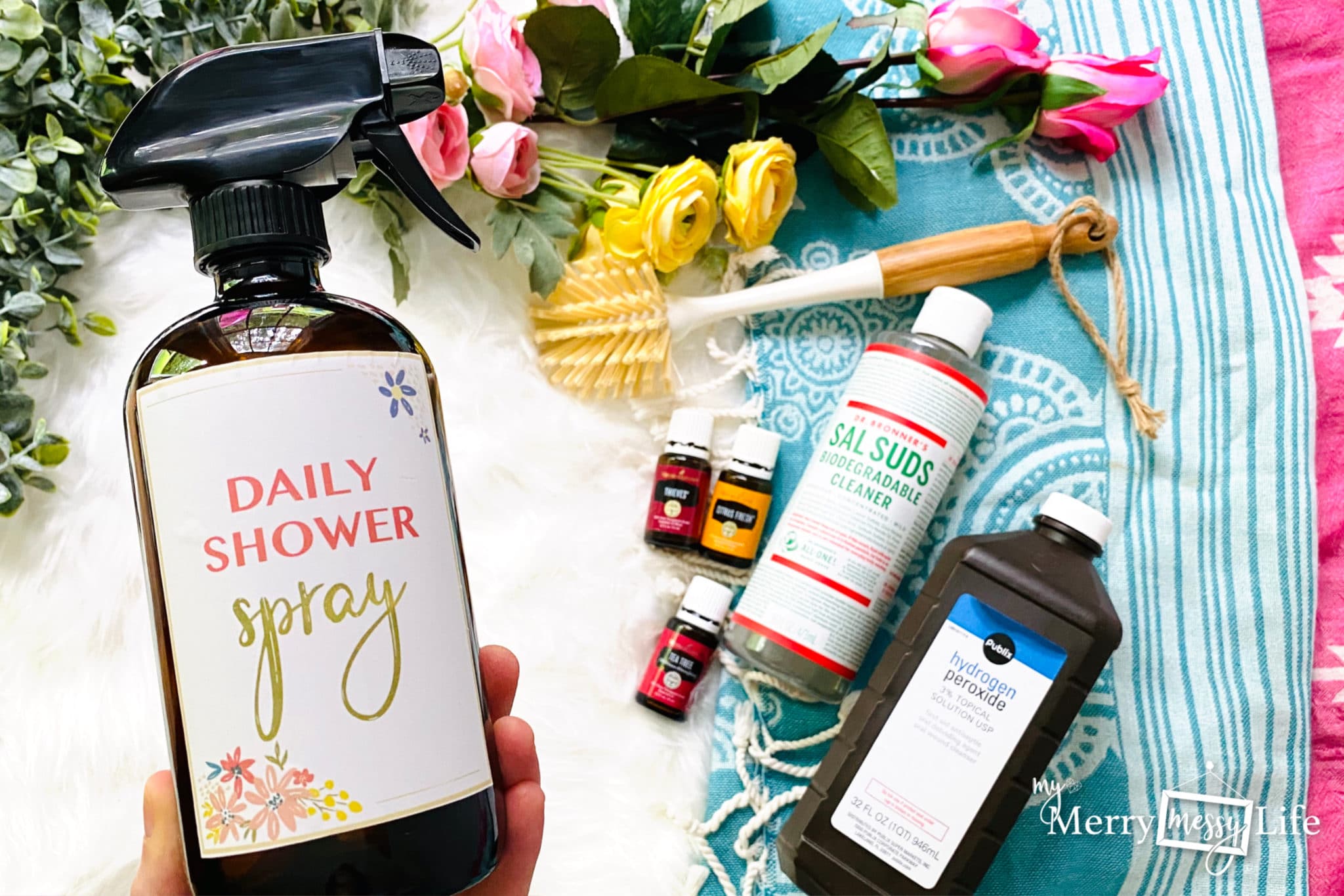 DIY Natural Daily Shower Spray using Hydrogen Peroxide, Sal Suds, and essential oils to keep your shower clean and prevent soap scum